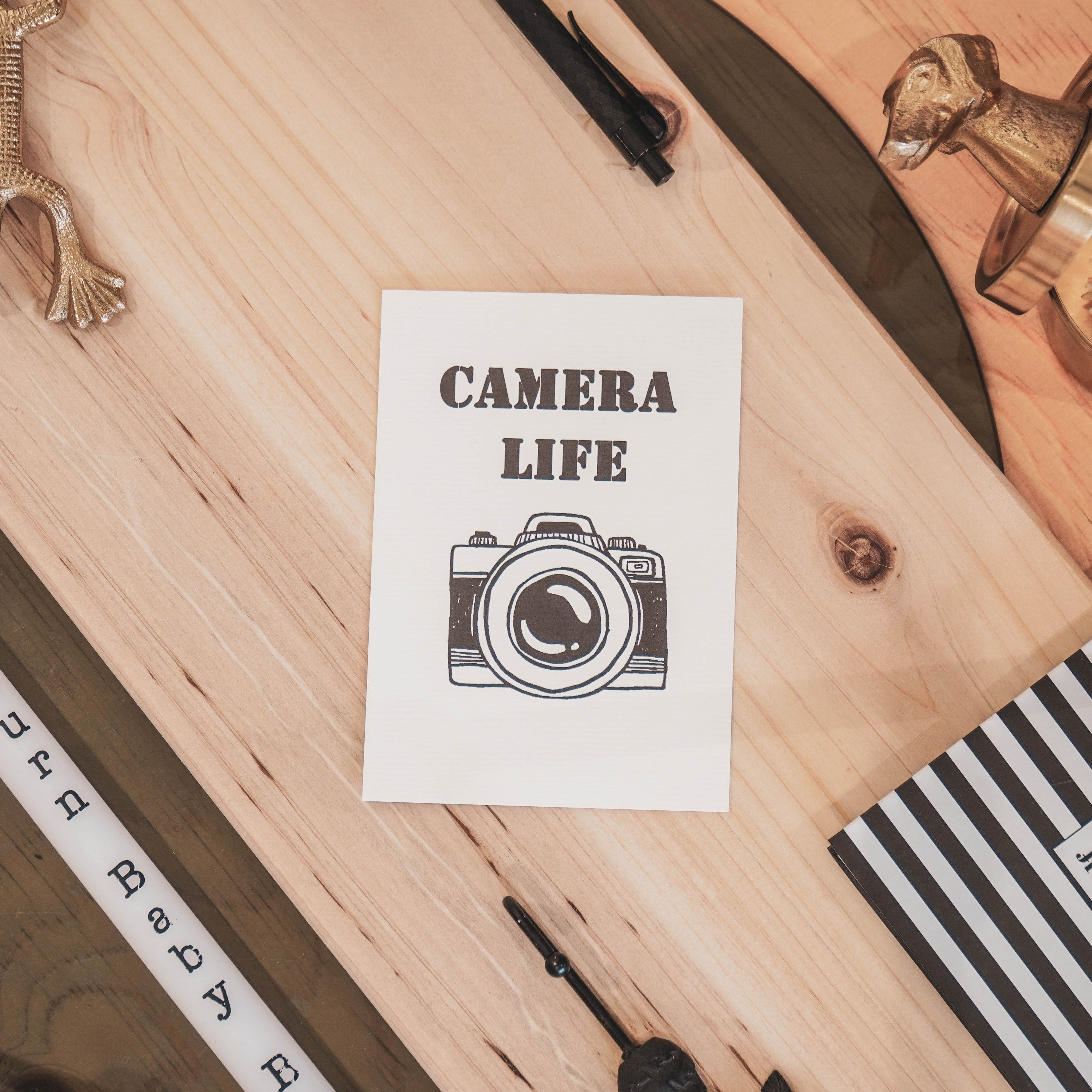 Kaart met camera en tekst Camera life 