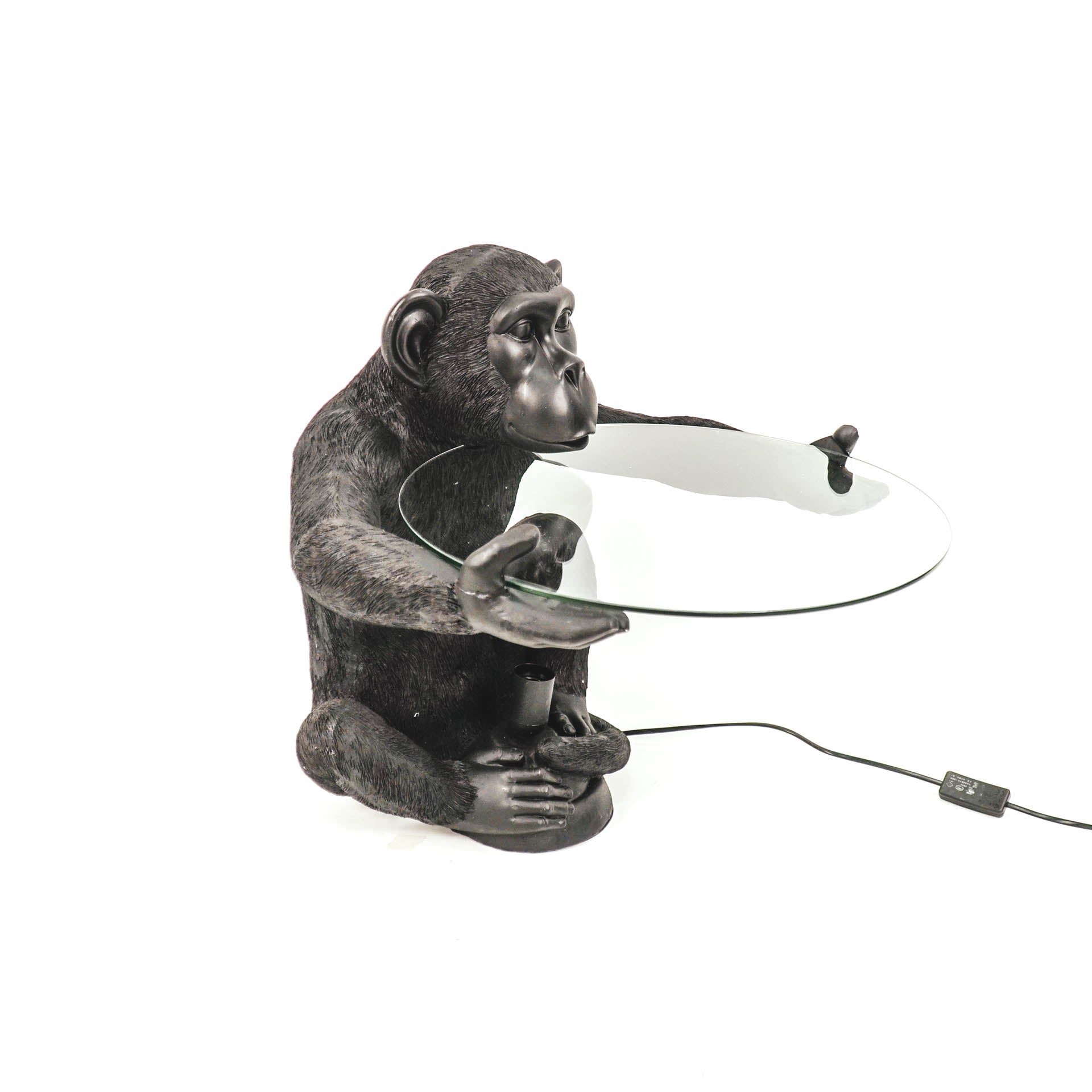 tafel en lamp in de vorm van een aapje